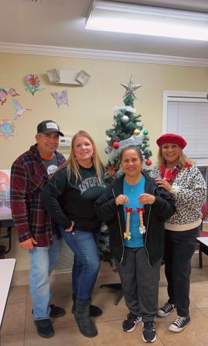 At the Senior Home in Fresno, handing out stockings, Xmas ornaments 