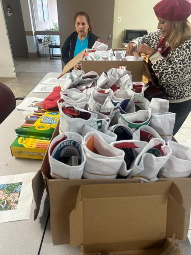 At the Senior Home in Fresno, handing out stockings, Xmas ornaments 